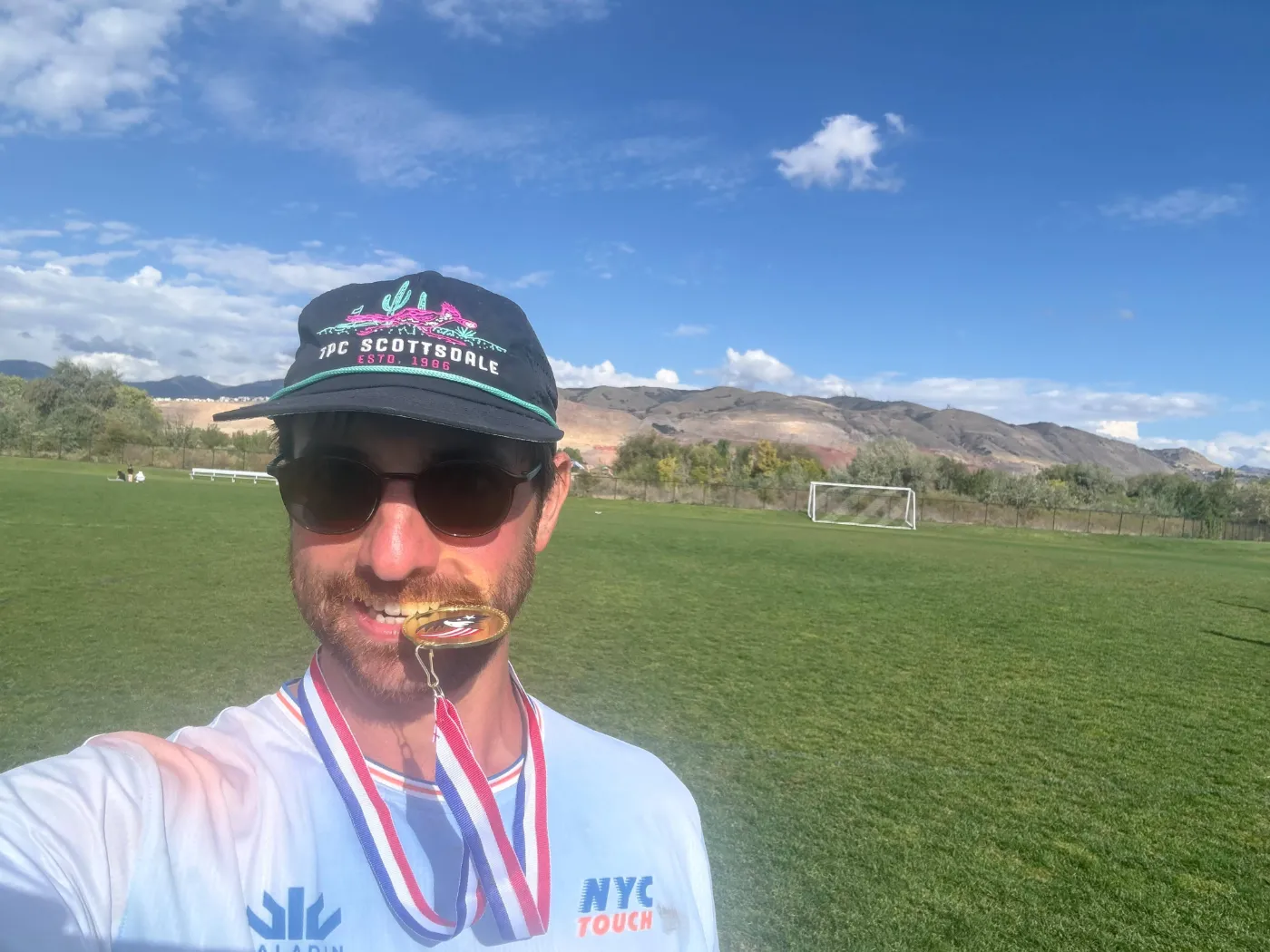 Maxwell K. Weiss with a medal after a touch rugby tournament